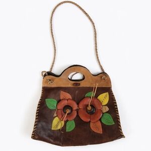 Genuine leather handbag with floral leather applique and braided leather strap